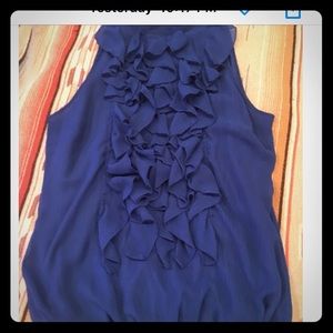 Royal blue sleeveless ruffle shirt.